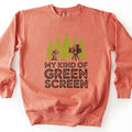 My Kind Of Green Screen Comfort Colors crewneck sweatshirt in Terracotta, laid flat. A hiker with an orange backpack gives a thumbs up to a vintage film camera on a tripod among green pine trees, above the words My Kind Of Green Screen in dark brown. Shown on a white background.