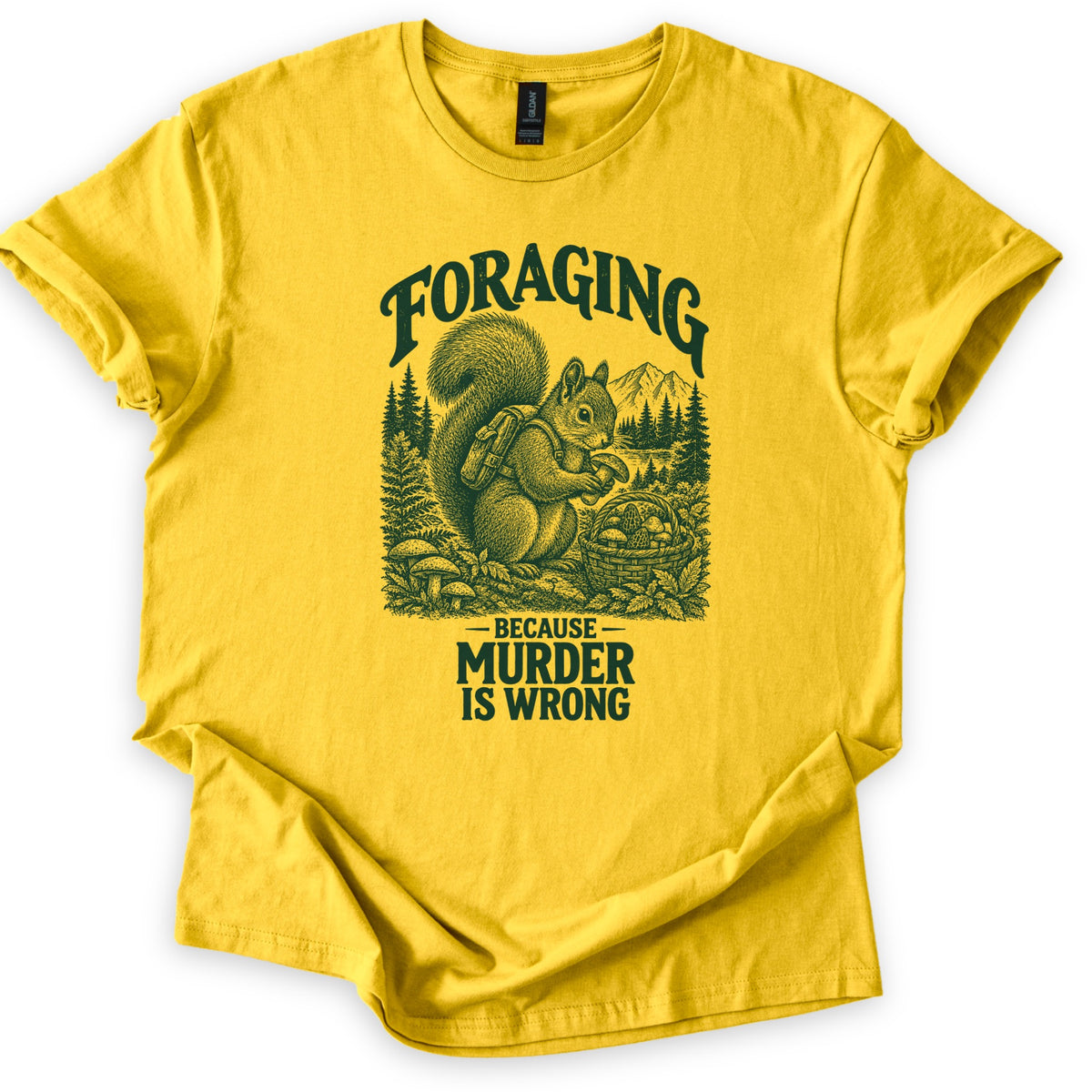 Foraging Murder Squirrel Comfort Colors T-shirt in Daisy, laid flat. Foraging arches over a dark green etched squirrel wearing a backpack and holding a mushroom beside a basket of mushrooms, with pines and a mountain behind. Below: Because Murder Is Wrong. Cuffed sleeves, white background.