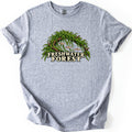 Freshwater Forest Comfort Colors T-shirt in Sport Grey, laid flat. An arch of driftwood draped in bright green aquarium moss shelters three small fish and rising bubbles, above the words Freshwater Forest in cream lettering. The sleeves are rolled on a white background.