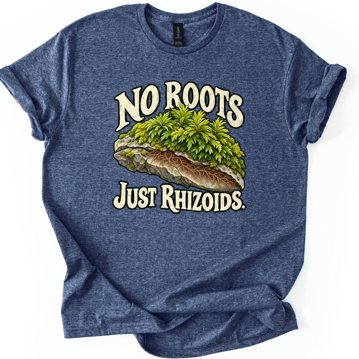 No Roots Just Rhizoids Comfort Colors T-shirt in Heather Navy, laid flat. Green moss grows on a gray rock cut open to show brown threadlike rhizoids, between cream words reading No Roots and Just Rhizoids. The shirt has cuffed sleeves on a white background.