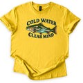 Cold Water Clear Mind Comfort Colors T-shirt in Daisy, laid flat. A speckled trout whose body holds a scene of pine trees, rocks and a turquoise river sits between the words Cold Water and Clear Mind in dark green. The sleeves are cuffed on a plain white background.