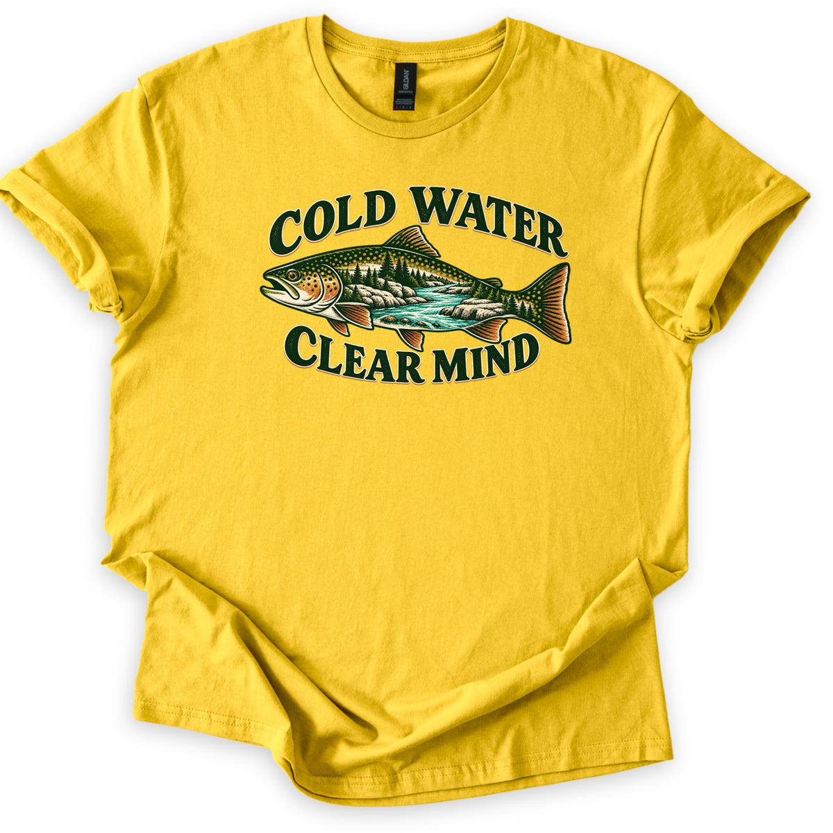 Cold Water Clear Mind Comfort Colors T-shirt in Daisy, laid flat. A speckled trout whose body holds a scene of pine trees, rocks and a turquoise river sits between the words Cold Water and Clear Mind in dark green. The sleeves are cuffed on a plain white background.