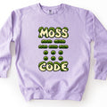 Moss Code Comfort Colors crewneck sweatshirt in Orchid, laid flat. The words MOSS and CODE in cream bubble letters overgrown with green moss, with rows of moss dashes and dots between them spelling MOSS in Morse code. Laid on a white background.