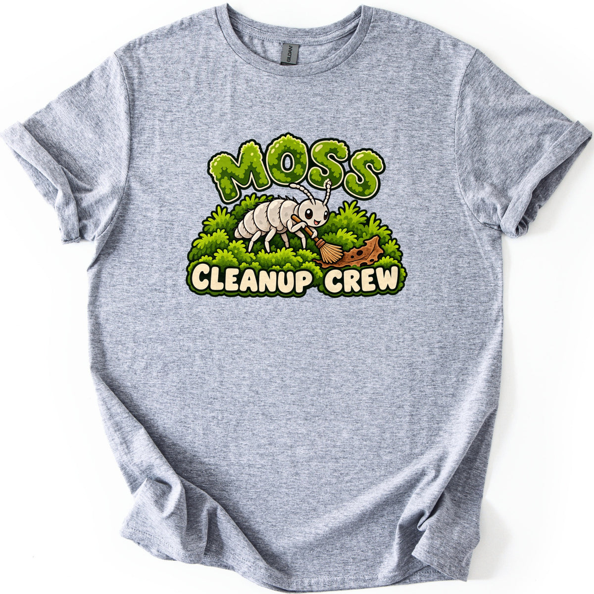 Moss Cleanup Crew Comfort Colors T-shirt in Sport Grey, laid flat. The word MOSS in green mossy letters tops a smiling white cartoon bug sweeping brown debris off a mound of moss with a broom, above the words CLEANUP CREW. Cuffed sleeves, on a white background.