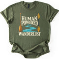Human Powered Wanderlust Comfort Colors T-shirt in Military Green, laid flat. A wooden canoe paddle and a yellow kayak paddle flank a winding turquoise river and the cream words Human Powered Wanderlust. The shirt has rolled sleeves and lies on a white background.
