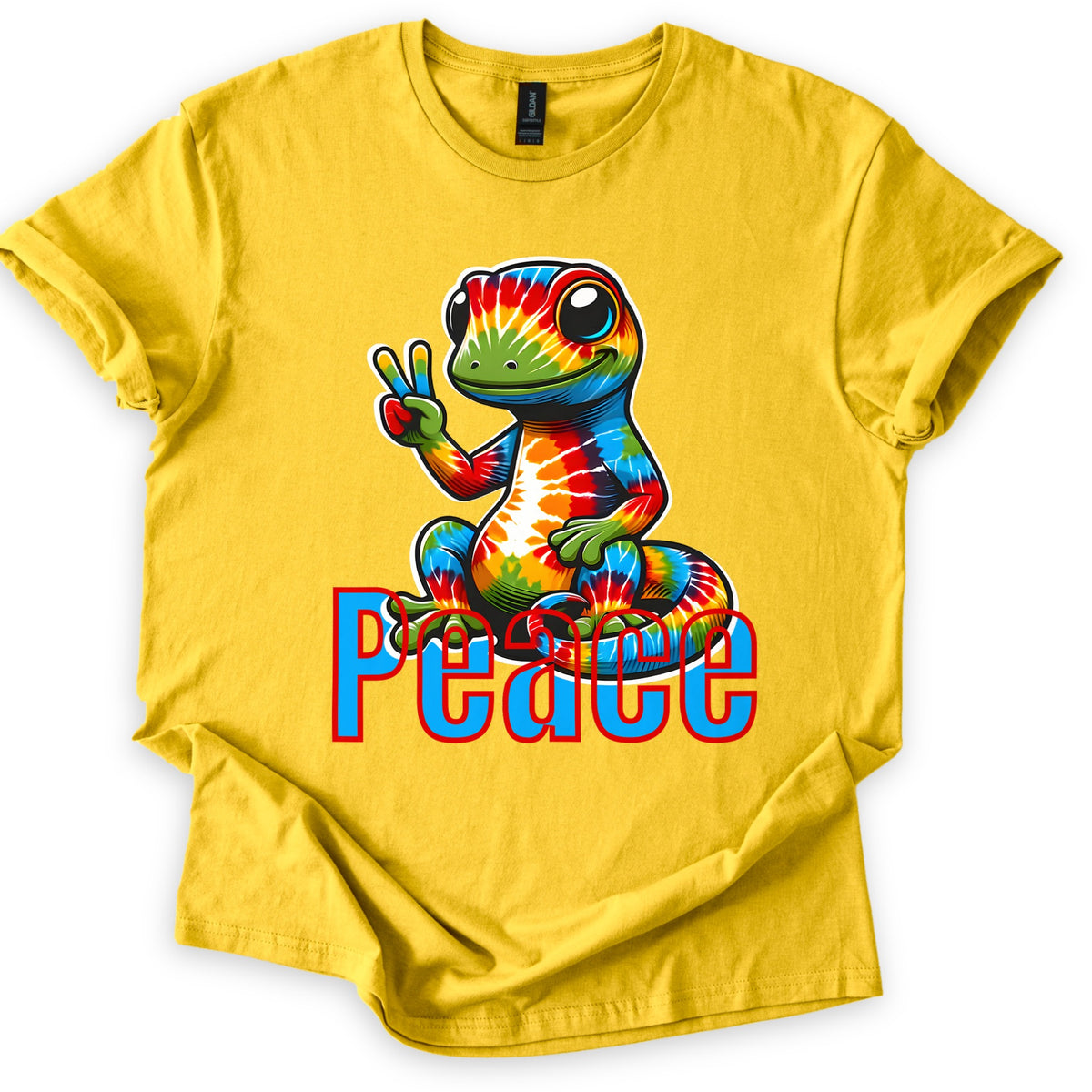 Rainbow Lizard Peace Comfort Colors T-shirt in Daisy, laid flat. A smiling cartoon lizard with tie-dye rainbow skin sits on its curled tail and flashes a peace sign above the word Peace in blue letters outlined in red. Cuffed sleeves on a white background.