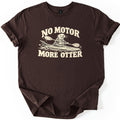 No Motor More Otter Comfort Colors T-shirt in Dark Chocolate, laid flat. A cream print of a smiling otter in a life vest paddling a kayak through splashing water, with NO MOTOR arched above and MORE OTTER below. The shirt has cuffed sleeves on a white background.