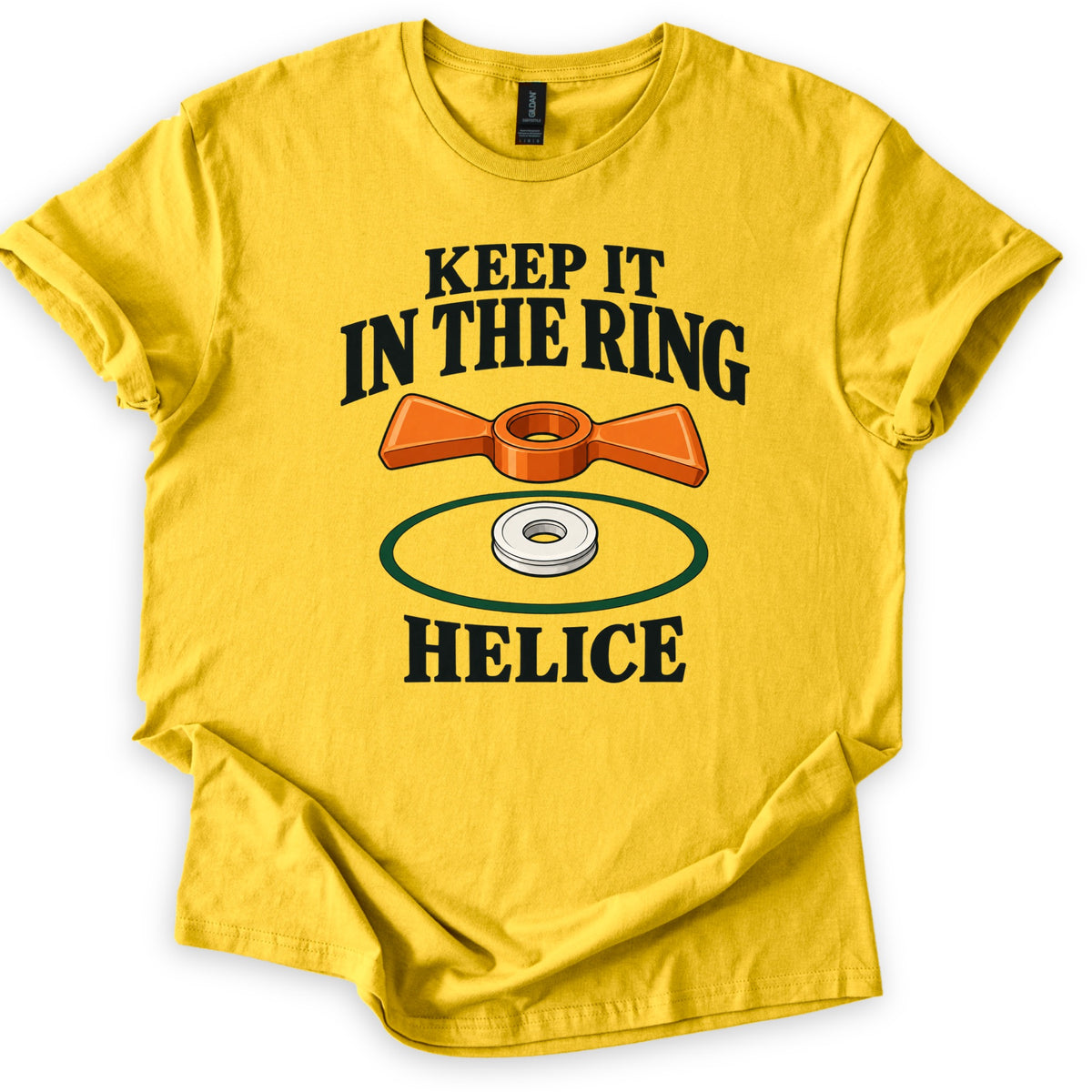Keep It in the Ring Comfort Colors T-shirt in Daisy, laid flat. An orange two-winged helice target sits above a white disc inside a green ring, between the words Keep It in the Ring and Helice. The shirt lies on a white background with cuffed sleeves.