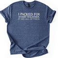 Packed For Every Weather Comfort Colors T-shirt in Heather Navy, laid flat. Off-white serif capital letters across the chest read I Packed For Every Weather. It Did All Of Them. The shirt lies on a white background with its sleeves cuffed and the hem loosely folded.