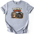 Point Taken Comfort Colors T-shirt in Sport Grey, laid flat. A cartoon porcupine holds a paw to its mouth beside a muddy green ATV with a quill stuck in its flat front tire, below the words Point Taken. The shirt lies on a white background with cuffed sleeves.