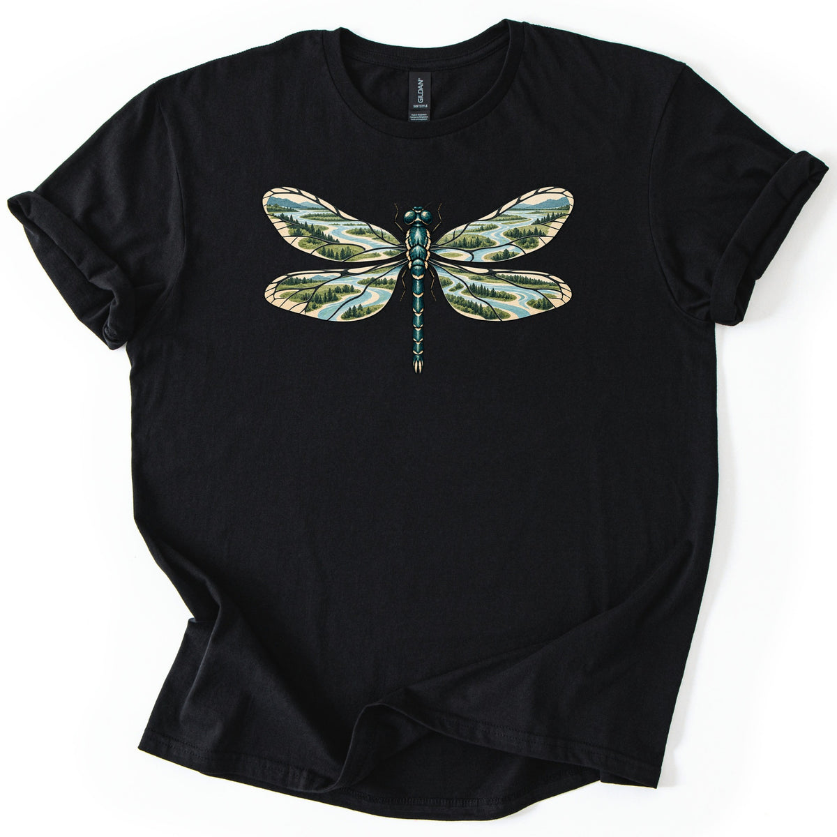 Braided River Dragonfly Comfort Colors T-shirt in Black, laid flat. A teal dragonfly with outspread wings, each wing filled with a scene of braided blue river channels, green forests and distant hills. No words. Sleeves are cuffed, shown on a white background.