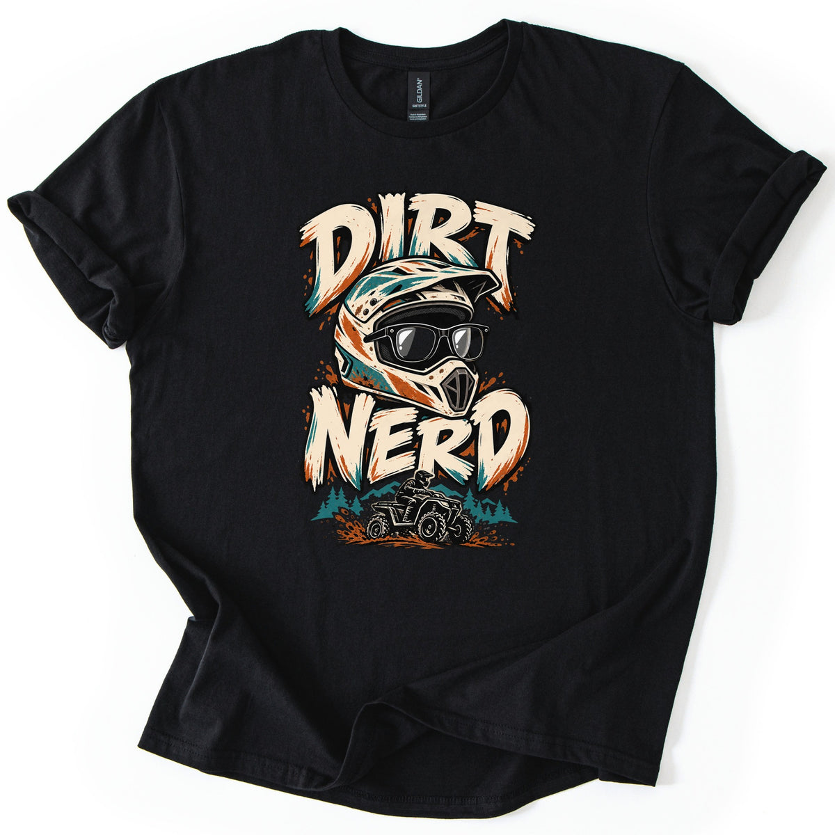 Dirt Nerd Comfort Colors T-shirt in Black, laid flat. The words Dirt Nerd in cream brushstroke letters frame a motocross helmet wearing black glasses, above a rider on an ATV spraying orange mud by teal pine trees. Shown on a white background.