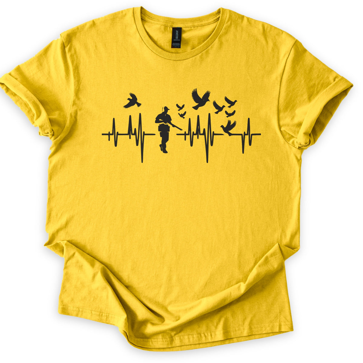Bird Hunter Comfort Colors T-shirt in Daisy, laid flat. A black heartbeat line crosses the chest around a silhouetted hunter in a cap holding a shotgun, with birds flying above and one perched on the line. No words. Cuffed sleeves on a white background.
