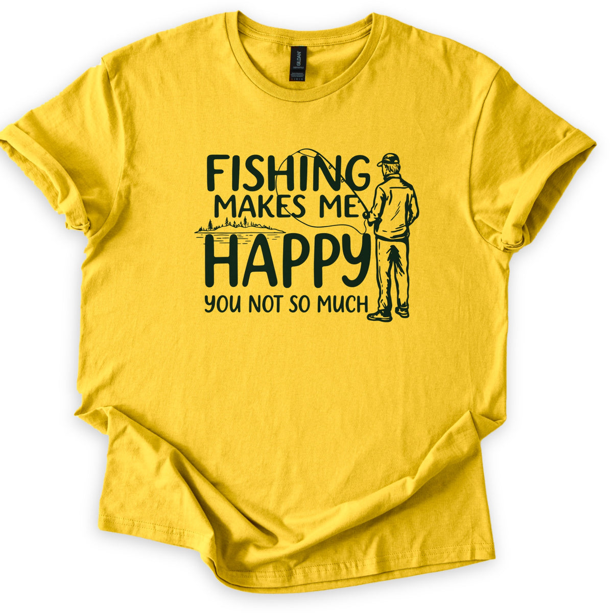 Fishing Makes Me Happy Comfort Colors T-shirt in Daisy, laid flat. Dark green text reads Fishing Makes Me Happy, You Not So Much, next to a drawing of a man in a cap, seen from behind, holding a fishing rod near a tree-lined lake. Shown with rolled sleeves on white.