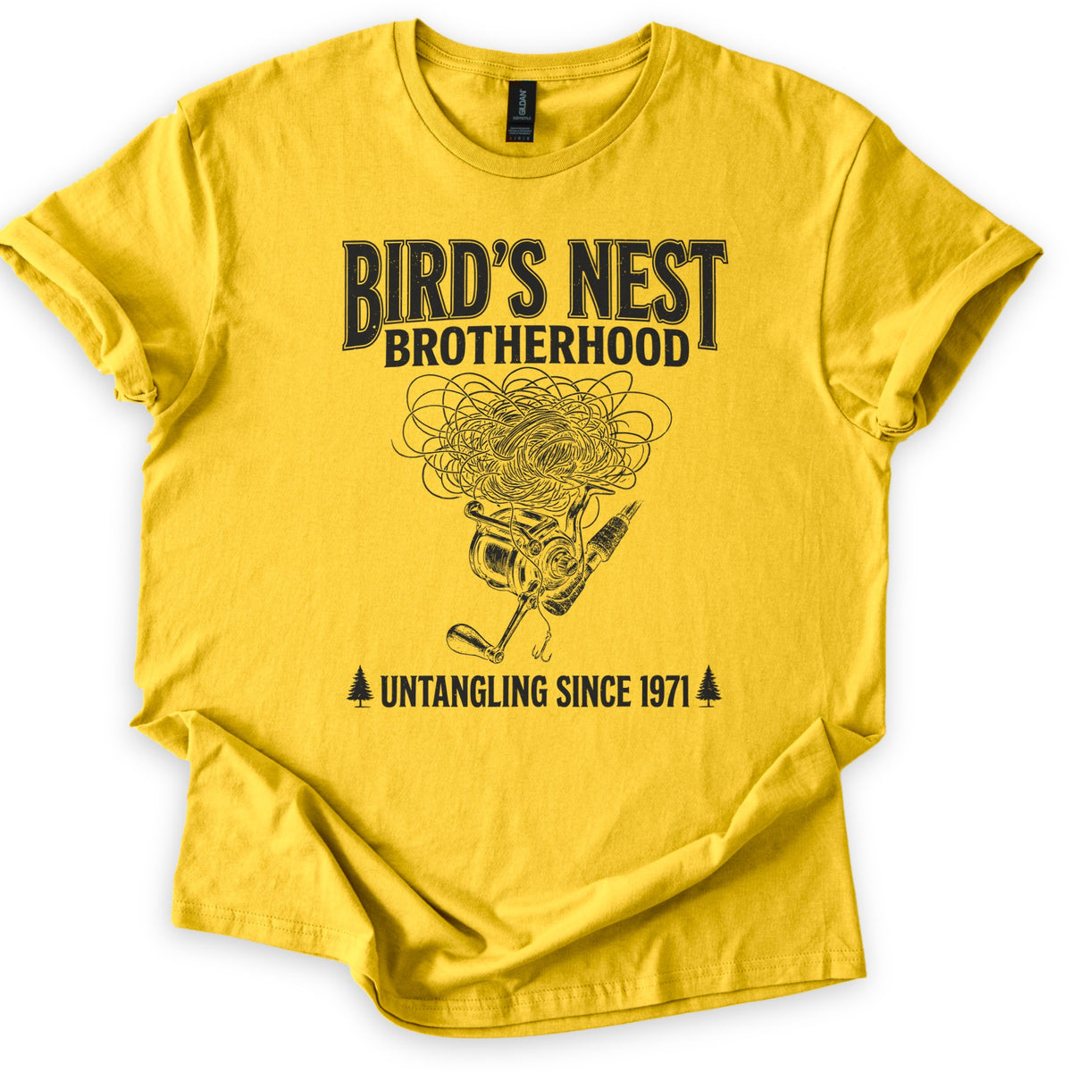Birds Nest Brotherhood Comfort Colors T-shirt in Daisy, laid flat. Black print reads Bird's Nest Brotherhood above a tangled mess of fishing line over a spinning reel, rod and hook, then Untangling Since 1971 between two pine trees. Sleeves cuffed, on a white backdrop.