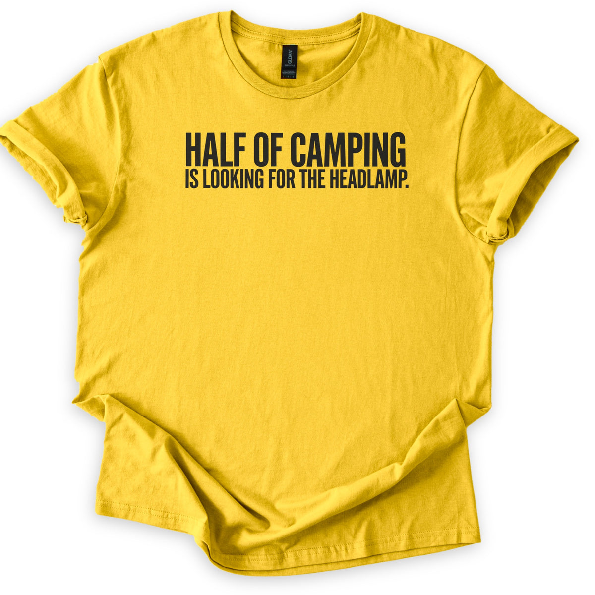Looking For The Headlamp Comfort Colors T-shirt in Daisy, laid flat. Bold black capital letters across the chest read HALF OF CAMPING, with IS LOOKING FOR THE HEADLAMP. on a smaller line below. The sleeves are cuffed and the shirt lies on a white surface.