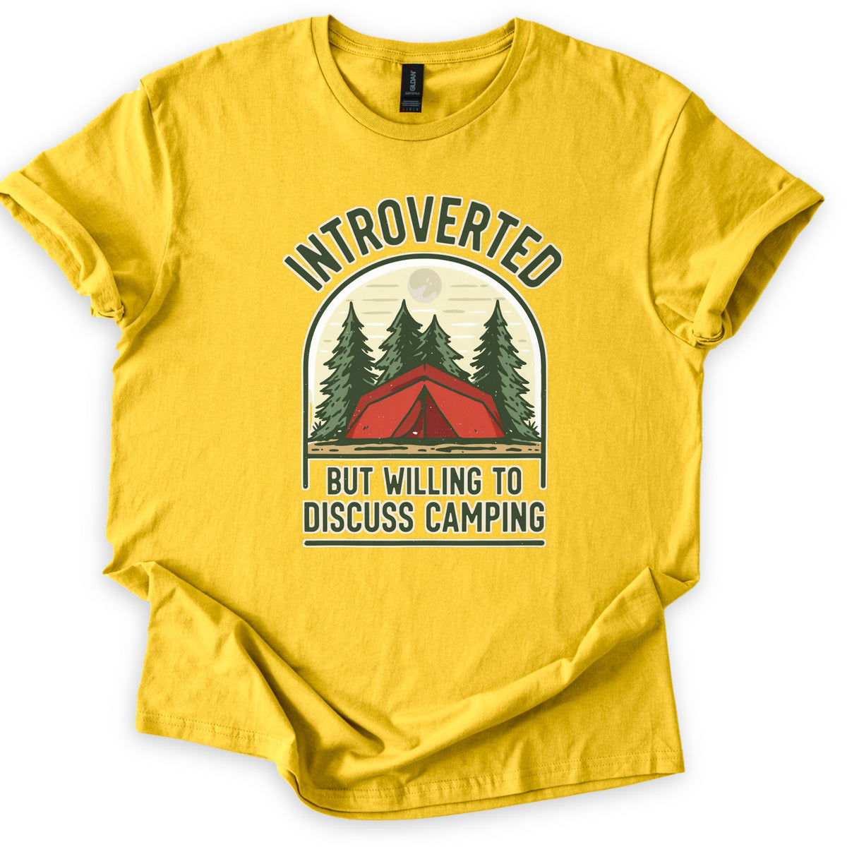 Introverted Camping Comfort Colors T-shirt in Daisy, laid flat. An arched badge shows a red tent among green pine trees under a pale moon, with INTROVERTED curved above and BUT WILLING TO DISCUSS CAMPING below in dark green. The shirt lies on a white background.