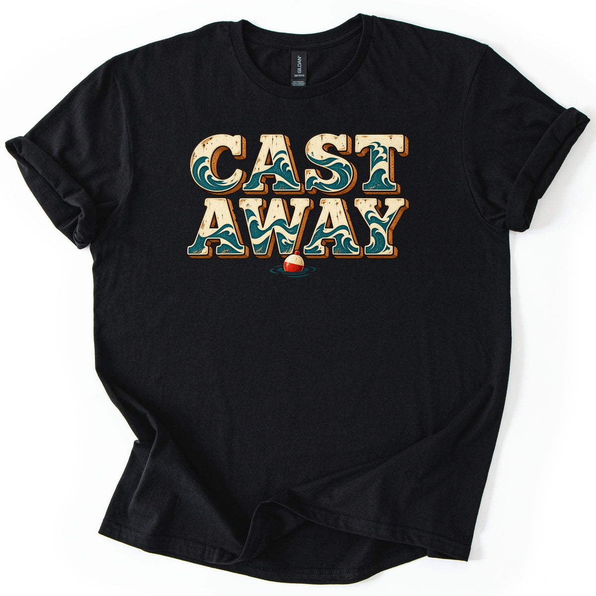 Cast Away Comfort Colors T-shirt in Black, laid flat. The words CAST AWAY in large cream block letters filled with teal ocean waves, with a red and white fishing bobber floating below. The shirt has rolled sleeves and lies on a white background.