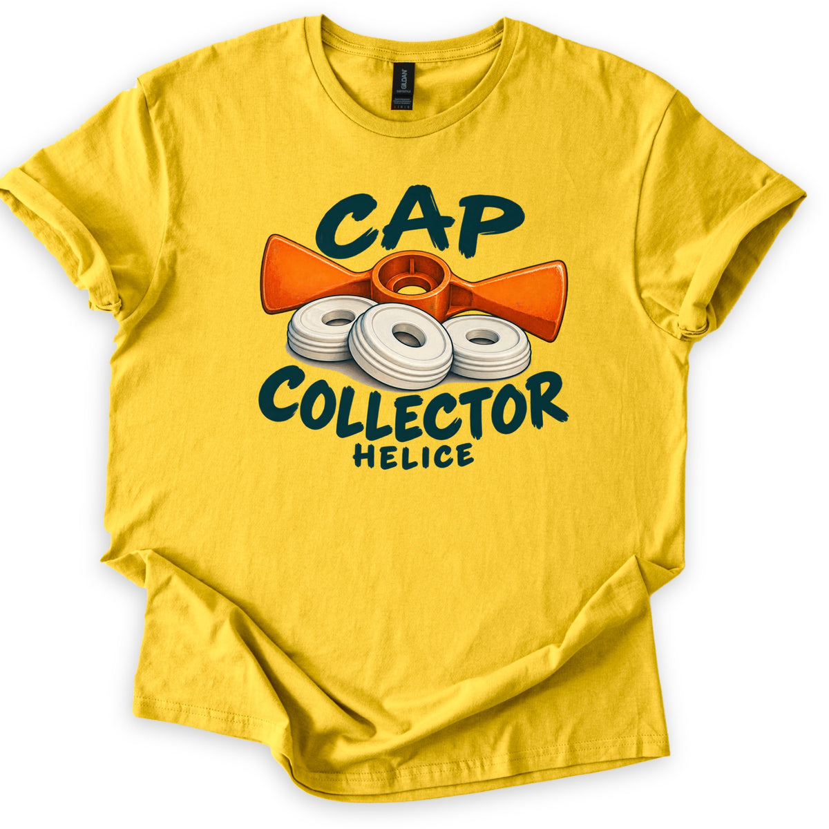 Cap Collector Comfort Colors T-shirt in Daisy, laid flat. Three white ringed discs rest in front of an orange propeller-shaped tool, framed by the words Cap Collector in dark green brush letters and Helice beneath. Shown with rolled sleeves on white.