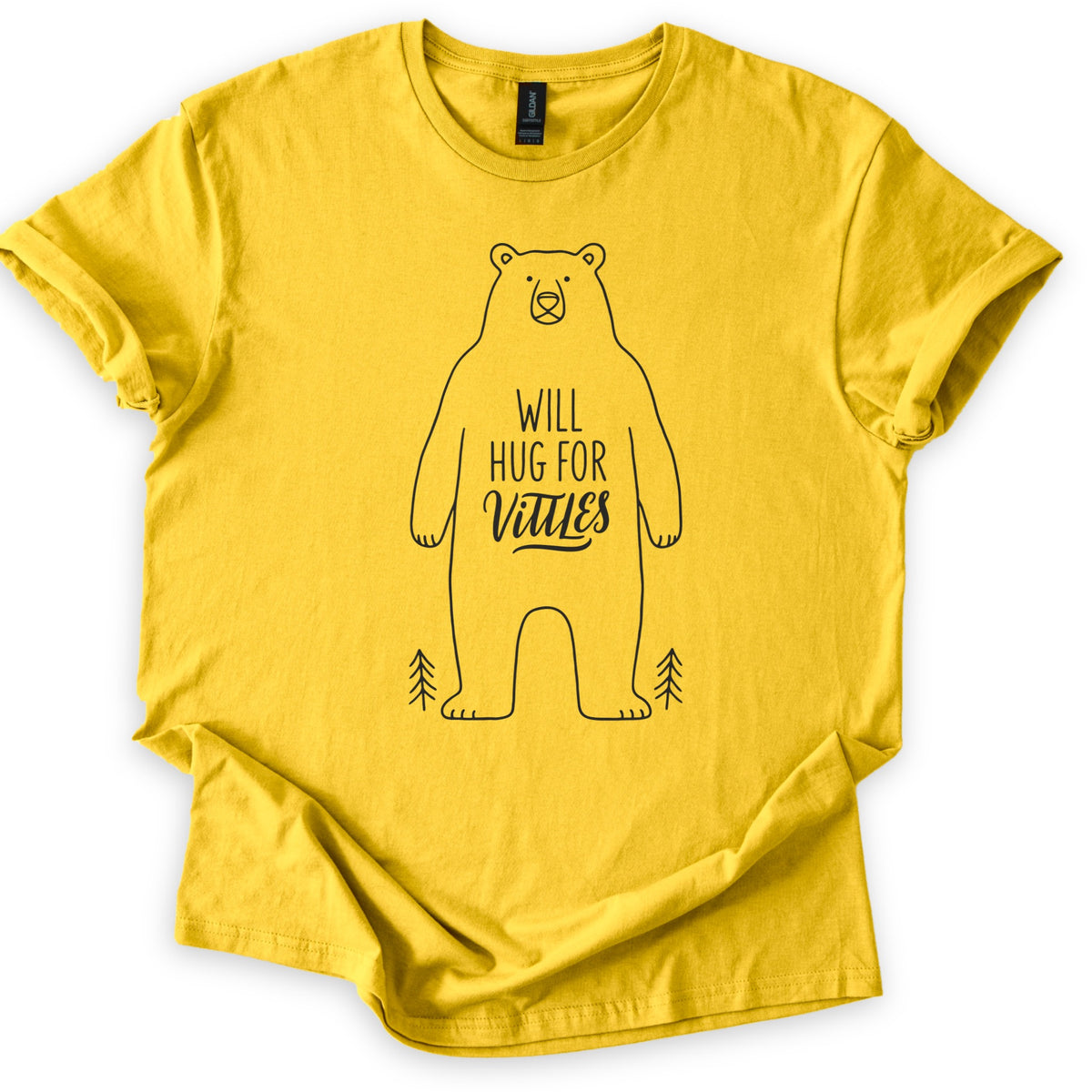 Will Hug For Vittles Bear Comfort Colors T-shirt in Daisy, laid flat. A black line drawing of a standing bear with the words WILL HUG FOR Vittles on its belly and a small pine tree at each foot. The shirt has rolled sleeves and lies on a white background.