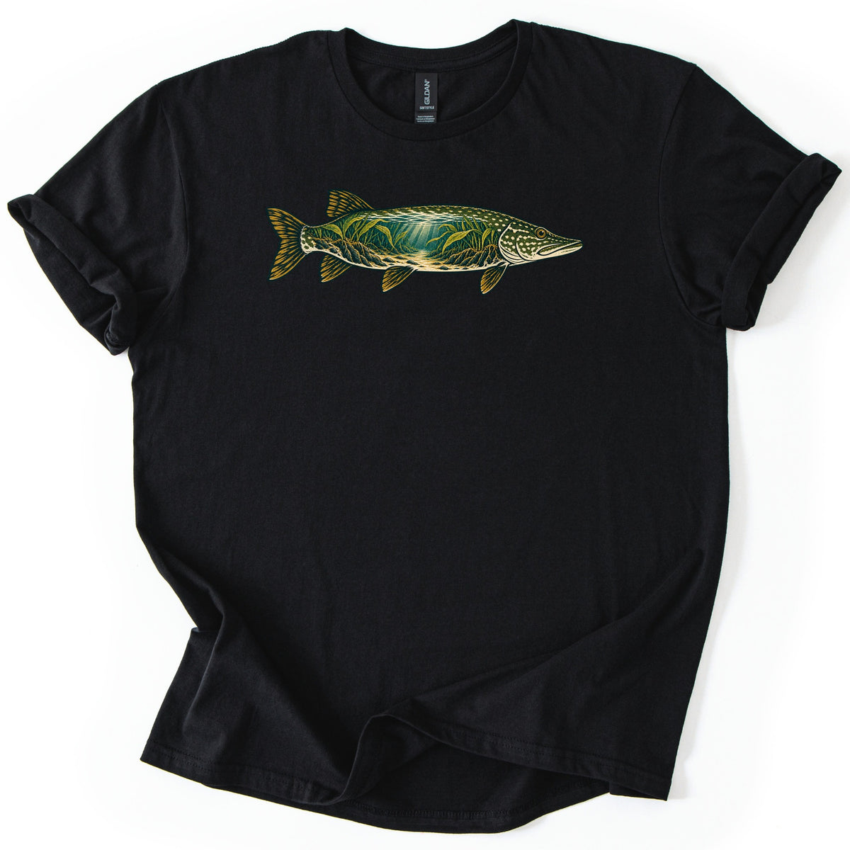 Pike Weed Bed Comfort Colors T-shirt in Black, laid flat. A northern pike faces right across the chest, its body filled with an underwater scene of green weeds and sun rays over a sandy bottom, with gold fins. No words. Sleeves are cuffed on a white background.