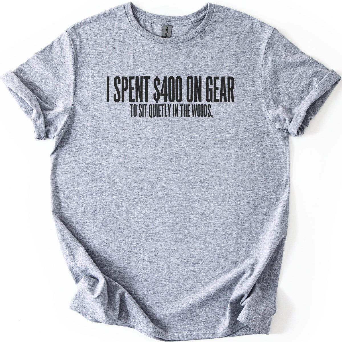 Gear To Sit Quietly Comfort Colors T-shirt in Sport Grey, laid flat. Black block letters across the chest read I SPENT $400 ON GEAR, with TO SIT QUIETLY IN THE WOODS. in smaller letters below. The shirt has rolled sleeves and lies on a white background.