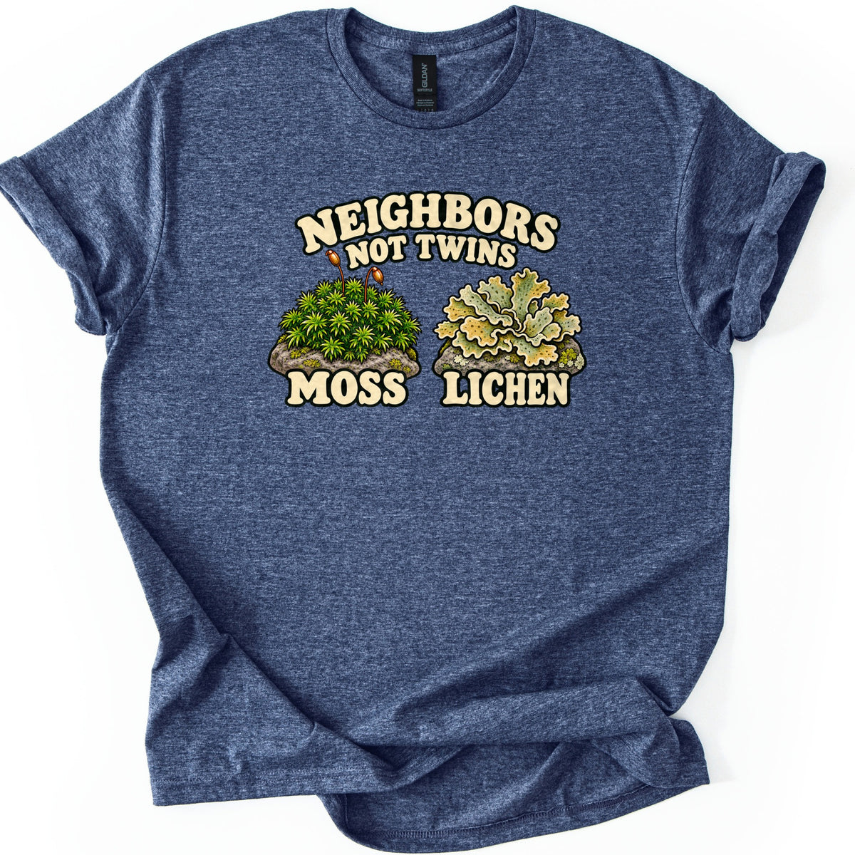 Neighbors Not Twins Comfort Colors T-shirt in Heather Navy, laid flat. Cream retro letters read Neighbors Not Twins above two rocks, one topped with green moss and two spore stalks labeled Moss, the other with pale green leafy lichen labeled Lichen. Sleeves rolled, on white.