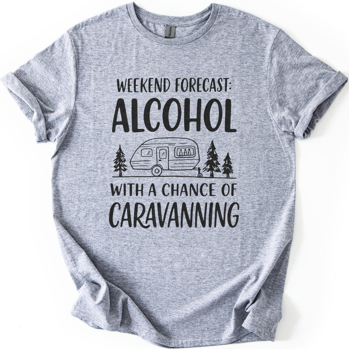 Weekend Forecast Caravanning Comfort Colors T-shirt in Sport Grey, laid flat. Black print reads Weekend Forecast: Alcohol With a Chance of Caravanning around a line drawing of a caravan with bottles in its window between pine trees. Sleeves are cuffed on a white background.