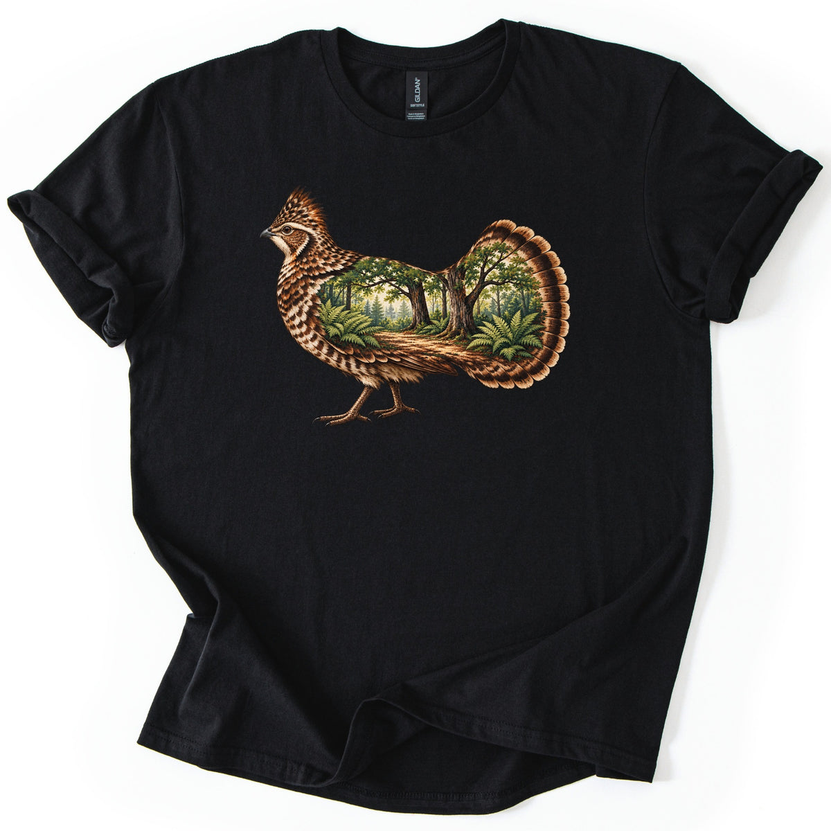 Ruffed Grouse Woods Comfort Colors T-shirt in Black, laid flat. A walking ruffed grouse with a crested head and barred brown feathers, its body and fanned tail filled with a forest scene of trees, ferns and a dirt path. No words. Sleeves rolled, on a white background.