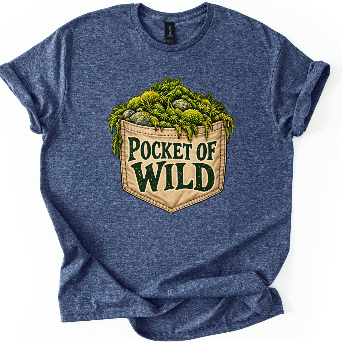 Pocket of Wild Comfort Colors T-shirt in Heather Navy, laid flat. A tan stitched pocket overflowing with green moss and mossy stones, with the words Pocket of Wild in dark green. The heathered shirt lies on a white background with cuffed sleeves.
