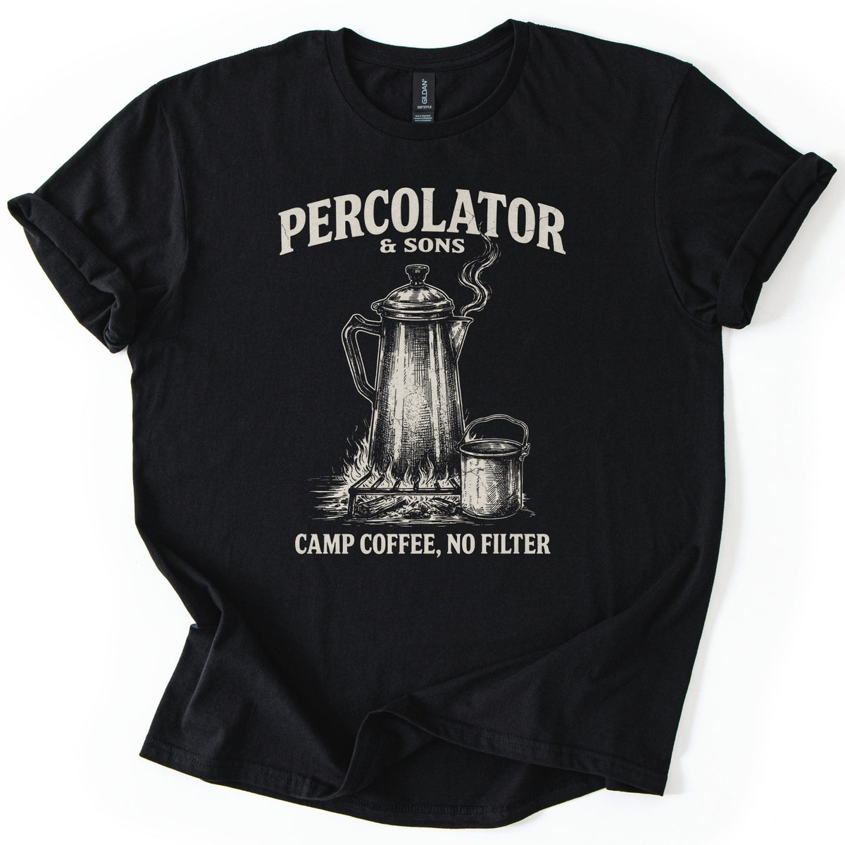 Percolator & Sons Comfort Colors T-shirt in Black, laid flat. A sketched coffee percolator steams on a grate over a campfire beside a tin cup, under the words Percolator & Sons and above Camp Coffee, No Filter, in cream ink. The sleeves are rolled on a white background.