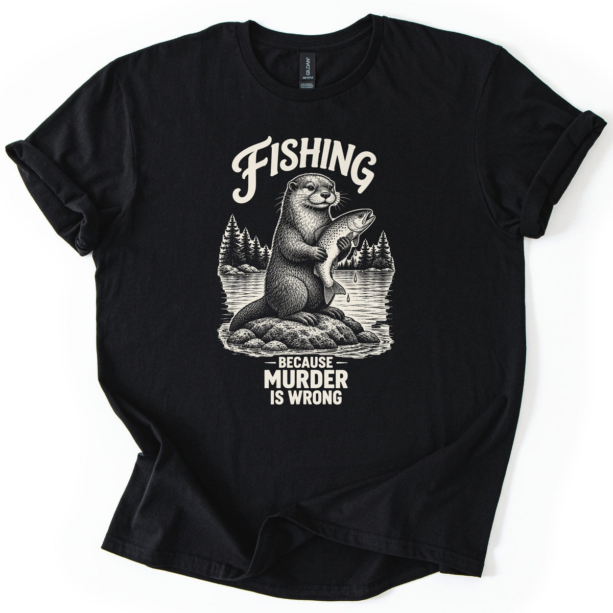 Fishing Murder Otter Comfort Colors T-shirt in Black, laid flat. A sketched otter sits on a rock in a lake holding a dripping trout, with pine trees behind it, under the word Fishing and above Because Murder Is Wrong in cream ink. Cuffed sleeves, white background.