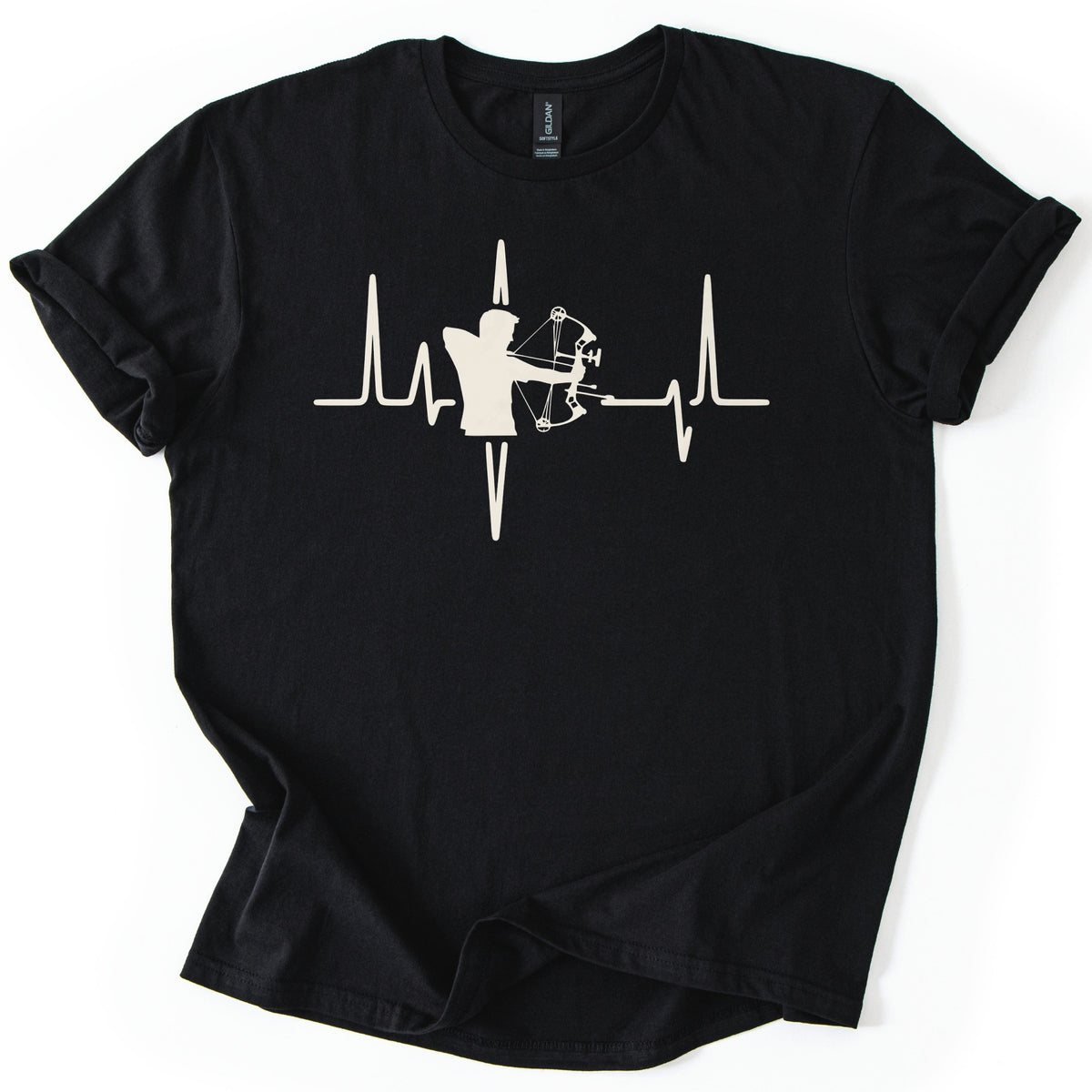 Compound Bow Archer Comfort Colors T-shirt in Black, laid flat. A cream silhouette of an archer drawing a compound bow sits in the middle of a heartbeat line across the chest, with no words. The shirt lies on a white background with its sleeves cuffed.