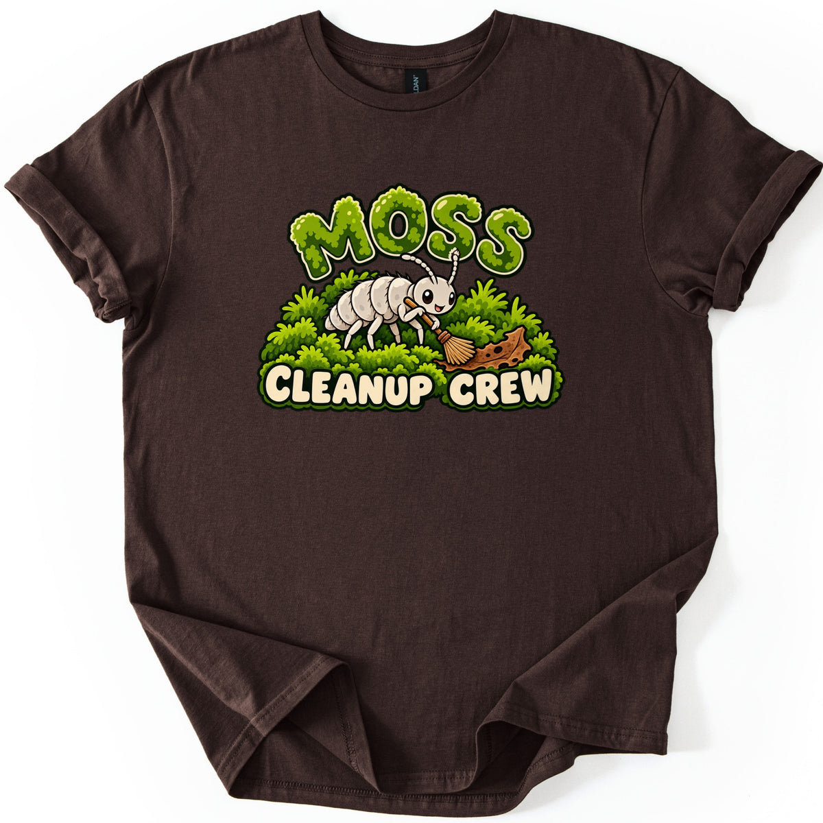 Moss Cleanup Crew Comfort Colors T-shirt in Dark Chocolate, laid flat. The word MOSS in green mossy letters tops a smiling white cartoon bug sweeping brown debris off a mound of moss with a broom, above the words CLEANUP CREW. Cuffed sleeves, on a white background.