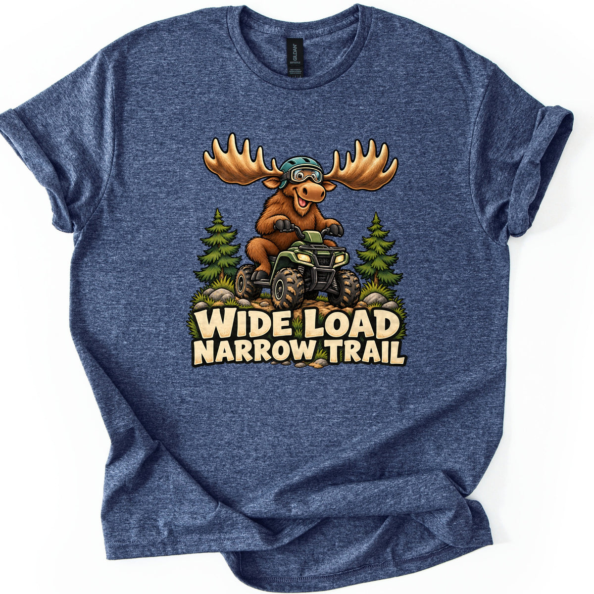 Wide Load Narrow Trail Comfort Colors T-shirt in Heather Navy, laid flat. A cartoon moose with huge antlers, a helmet and goggles rides a green ATV on a dirt trail between pine trees above the words Wide Load Narrow Trail. The shirt lies on a white background with cuffed sleeves.