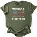 Fish America Fish Yeah Comfort Colors T-shirt in Military Green, laid flat. An American flag of red and cream fishing rods and reels, with rows of hooks in the blue corner, sits between 'MERICA and F*SH YEAH in cream letters. Sleeves rolled, on a white background.