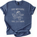 Birds Watch Back Birder Comfort Colors T-shirt in Heather Navy, laid flat. Cream line art of a cartoon bird in sunglasses perched on a branch beside a pair of binoculars, with a small sun, between the words Bird Watching Goes Both Ways. Sleeves rolled, on a white background.