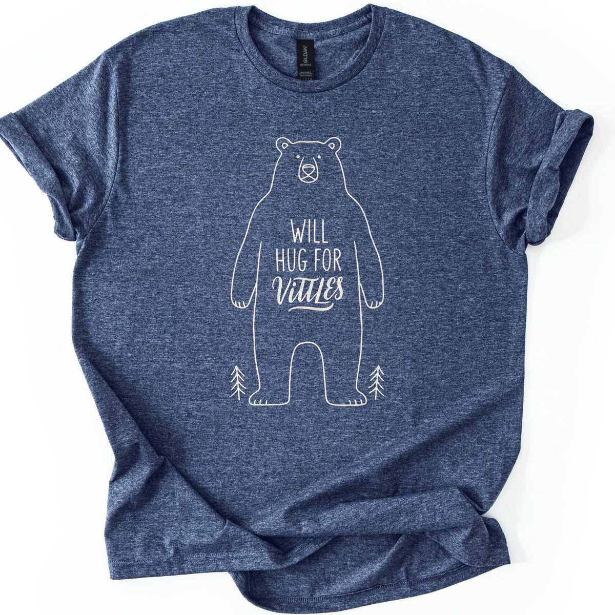 Will Hug For Vittles Bear Comfort Colors T-shirt in Heather Navy, laid flat. A cream line drawing of a standing bear with the words WILL HUG FOR Vittles on its belly and a small pine tree at each foot. The shirt has rolled sleeves and lies on a white background.