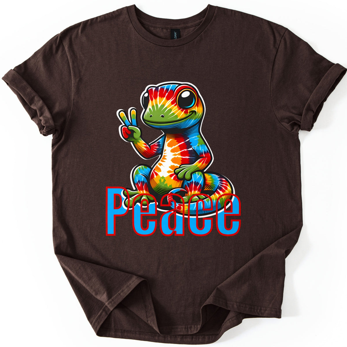 Rainbow Lizard Peace Comfort Colors T-shirt in Dark Chocolate, laid flat. A smiling cartoon lizard with tie-dye rainbow skin sits on its curled tail and flashes a peace sign above the word Peace in blue letters outlined in red. Cuffed sleeves on a white background.